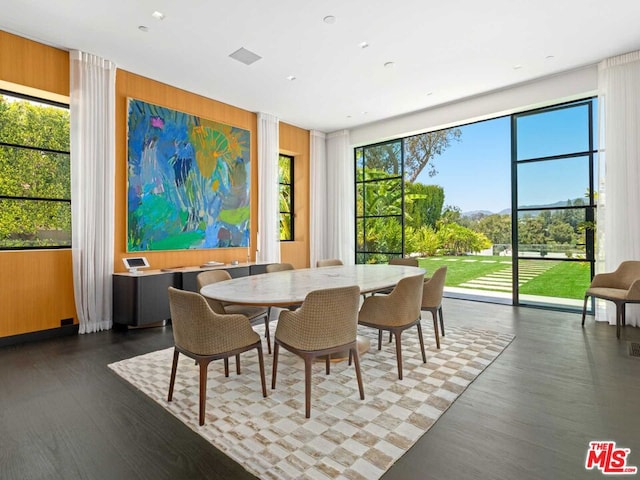 dining space featuring dark hardwood / wood-style floors