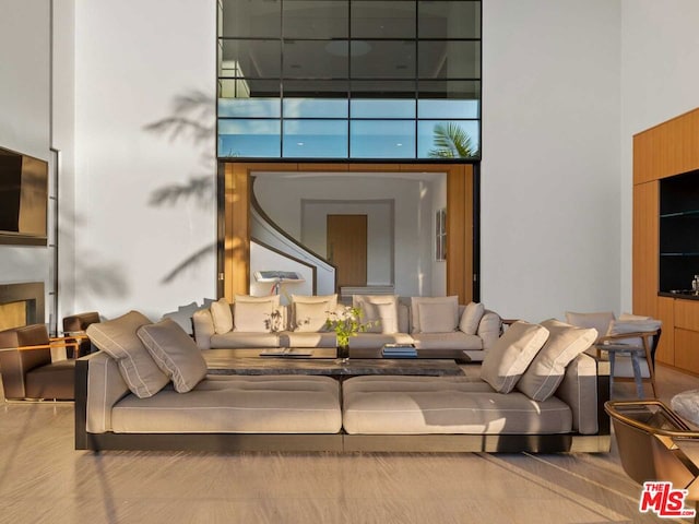 living room with a towering ceiling