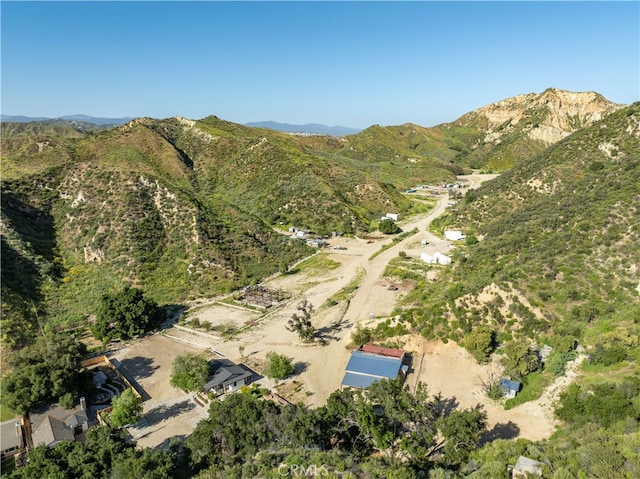 birds eye view of property with a mountain view