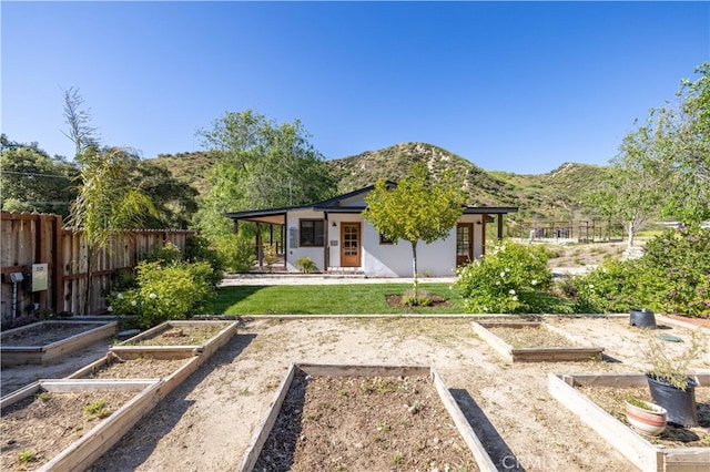 back of house with a mountain view