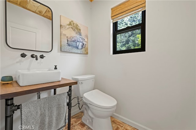 bathroom with sink and toilet