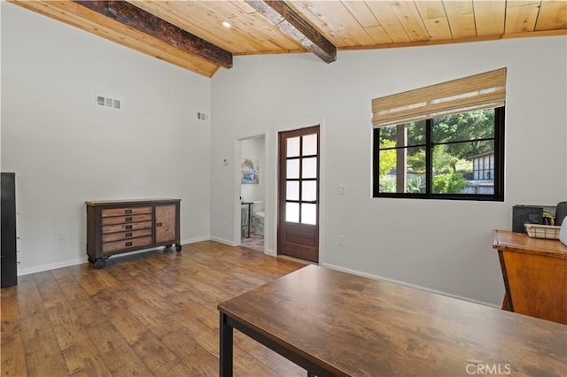 foyer with wood-type flooring, wooden ceiling, and lofted ceiling with beams