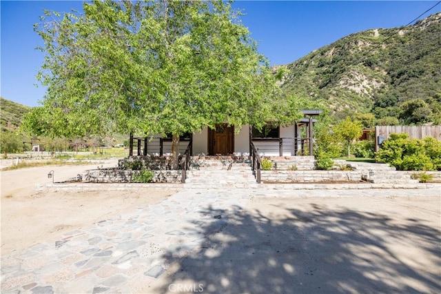 obstructed view of property with a mountain view