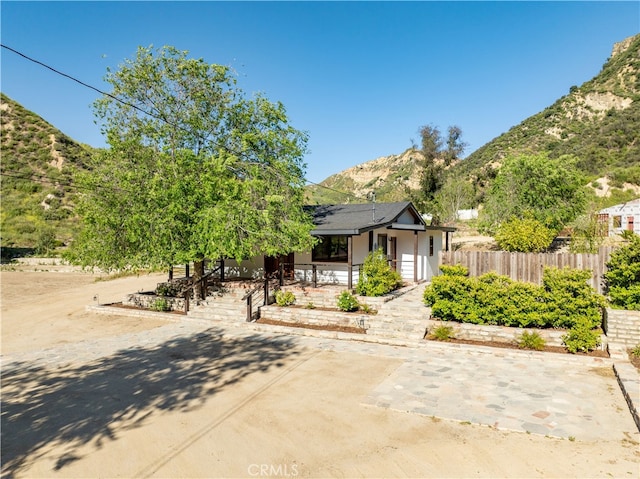 view of front of home featuring a mountain view