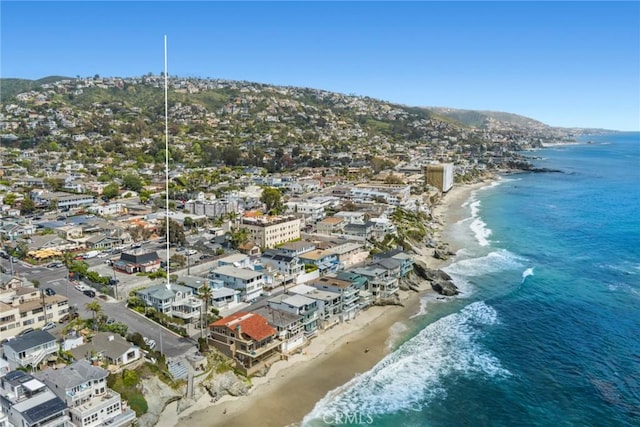 aerial view with a water view and a view of the beach