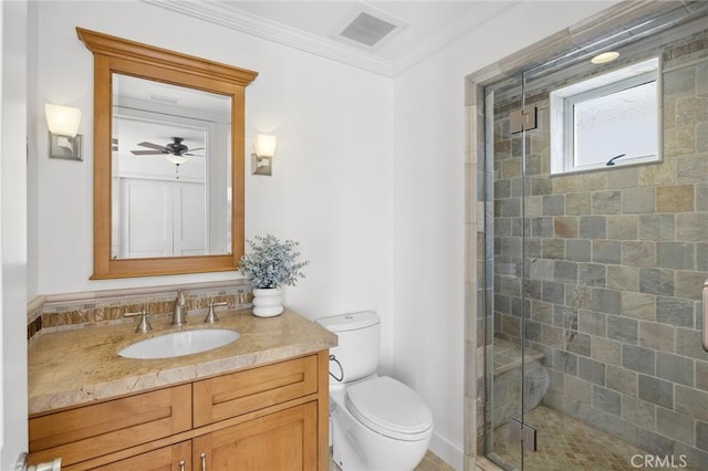 full bathroom featuring toilet, vanity, visible vents, ornamental molding, and a stall shower