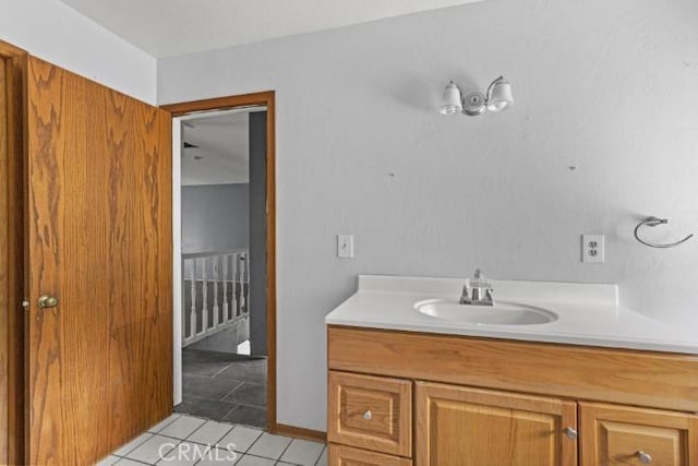 bathroom featuring tile patterned flooring and vanity