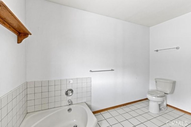 bathroom with tile patterned floors, toilet, and a bath