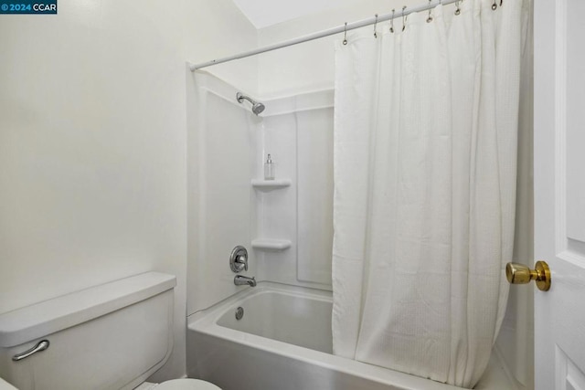 bathroom featuring toilet and shower / bath combo