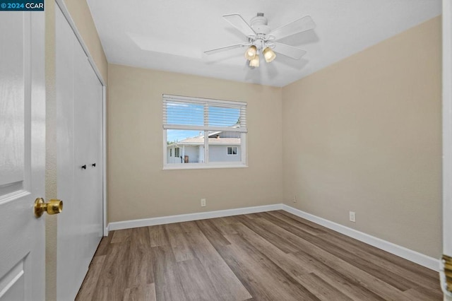 empty room featuring light hardwood / wood-style flooring and ceiling fan