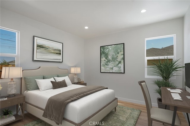 bedroom featuring recessed lighting, light wood-style flooring, and baseboards