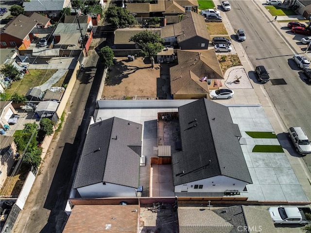 birds eye view of property with a residential view