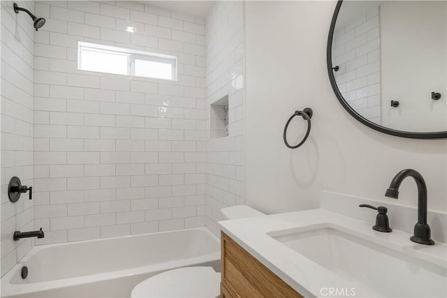 bathroom featuring shower / washtub combination, vanity, and toilet