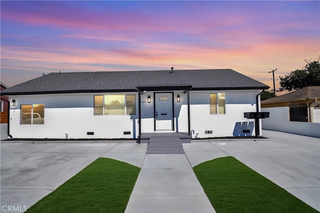 view of front facade with crawl space, roof with shingles, and stucco siding