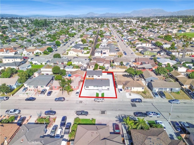 birds eye view of property with a residential view and a mountain view