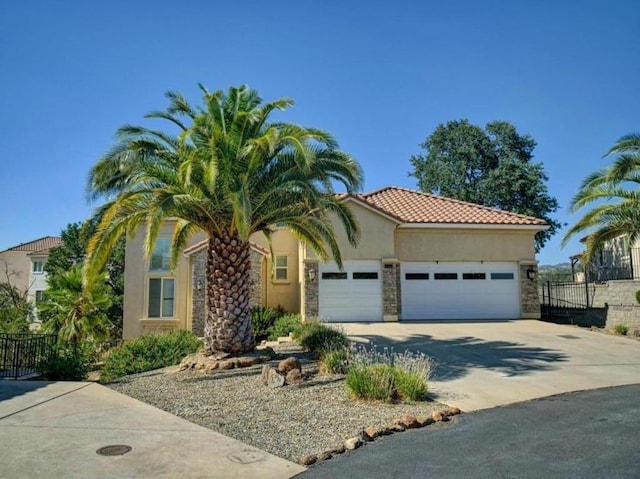 mediterranean / spanish-style home featuring a garage