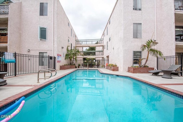 view of pool featuring a patio