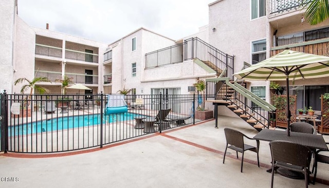 view of swimming pool featuring a patio area