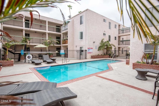 view of pool featuring a patio area