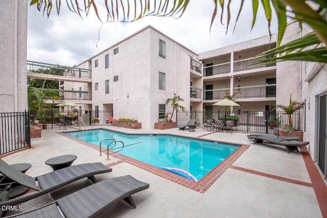 view of pool featuring a patio