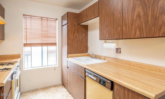 kitchen with sink and white appliances