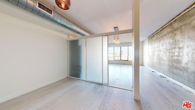 spare room featuring hardwood / wood-style floors