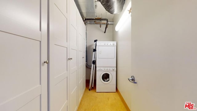 washroom with stacked washer / dryer