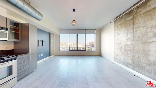 kitchen with electric range and light wood-type flooring