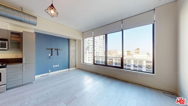 unfurnished living room featuring light hardwood / wood-style flooring