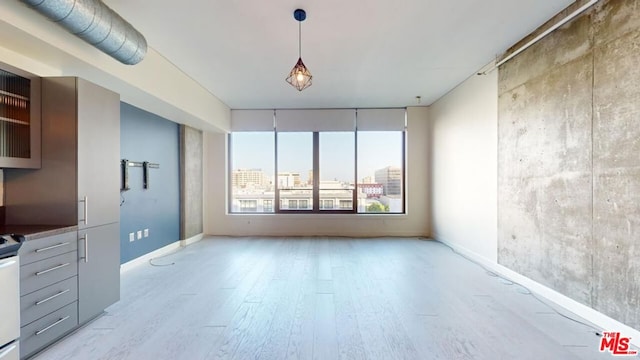 unfurnished living room with light hardwood / wood-style floors