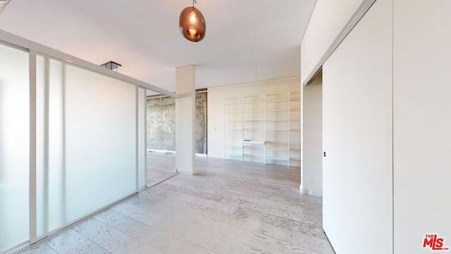 hallway with light wood-type flooring