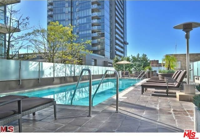 view of pool featuring a patio