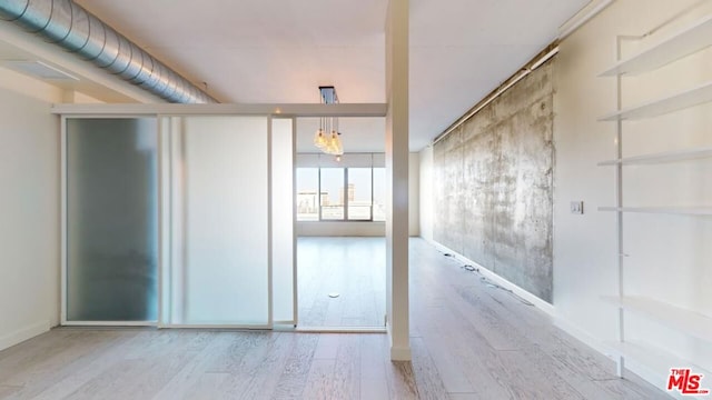 spare room featuring wood-type flooring