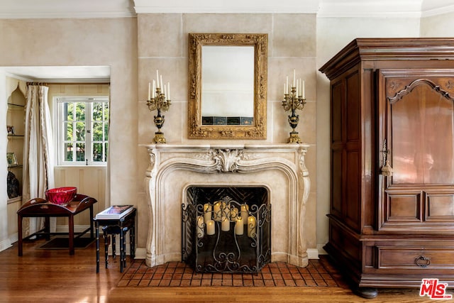 interior space featuring crown molding and dark hardwood / wood-style floors