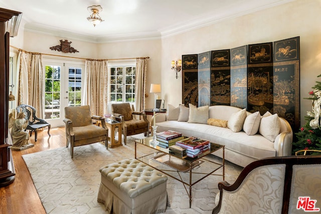 living room featuring french doors, crown molding, and hardwood / wood-style flooring