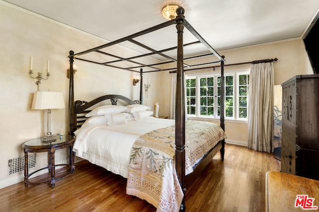 bedroom featuring hardwood / wood-style flooring