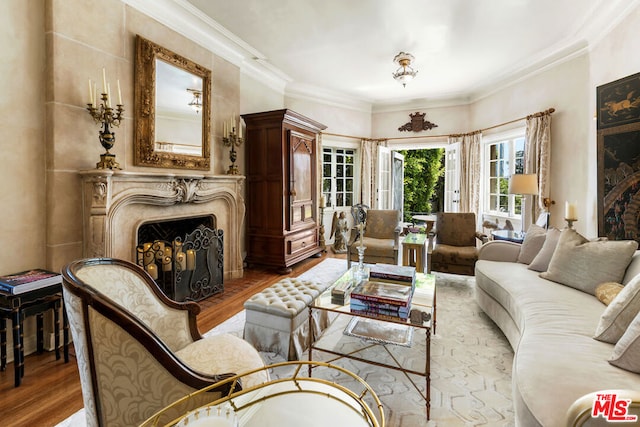 living room with hardwood / wood-style floors and crown molding