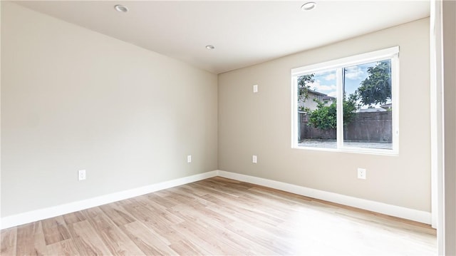 spare room featuring light hardwood / wood-style floors