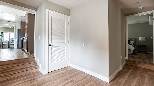 corridor featuring light hardwood / wood-style floors