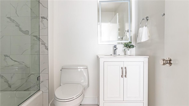 full bathroom featuring toilet, vanity, and tiled shower / bath