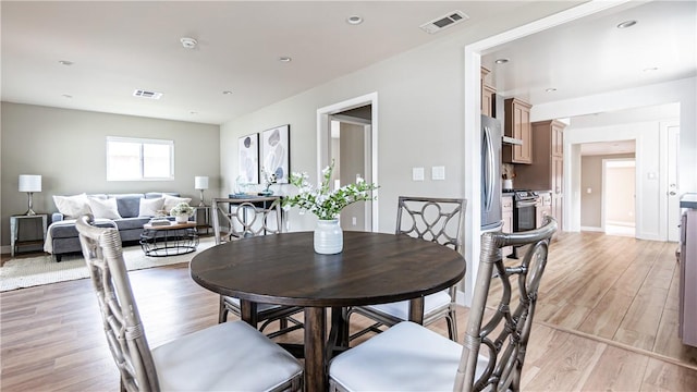 dining room with light hardwood / wood-style floors