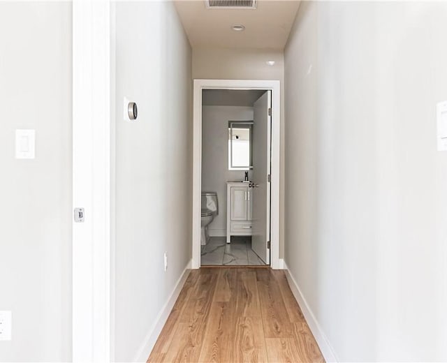 hall featuring light wood-type flooring