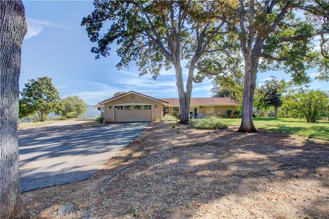 single story home with a garage