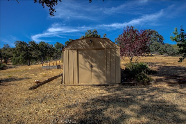 view of outdoor structure featuring a rural view