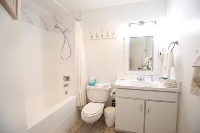 full bathroom with shower / bath combo with shower curtain, tile patterned flooring, vanity, and toilet