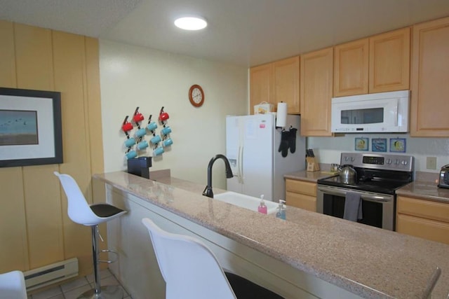 kitchen with light brown cabinetry, sink, a baseboard radiator, and white appliances