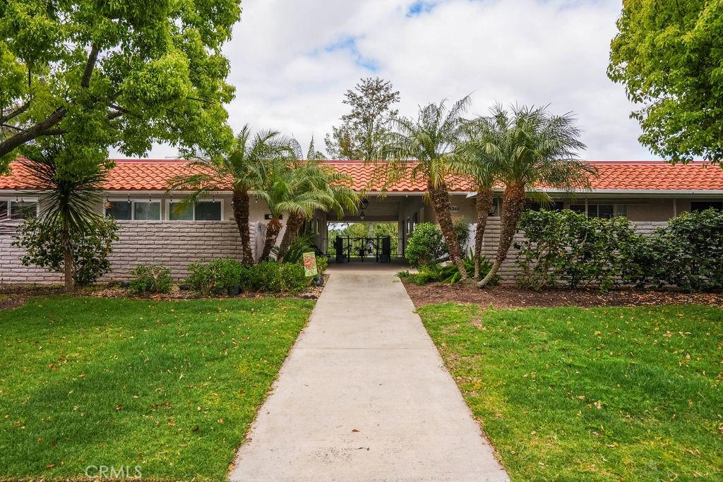 mediterranean / spanish home featuring a front yard