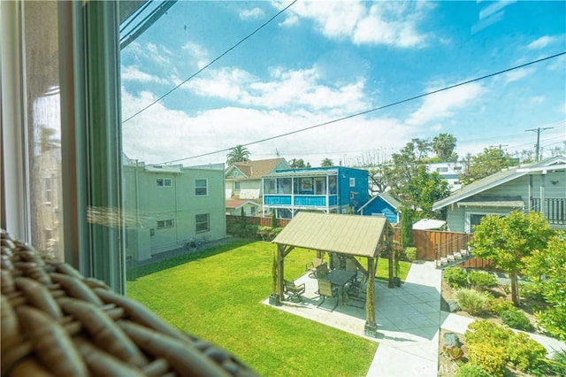 surrounding community featuring a patio area and a lawn