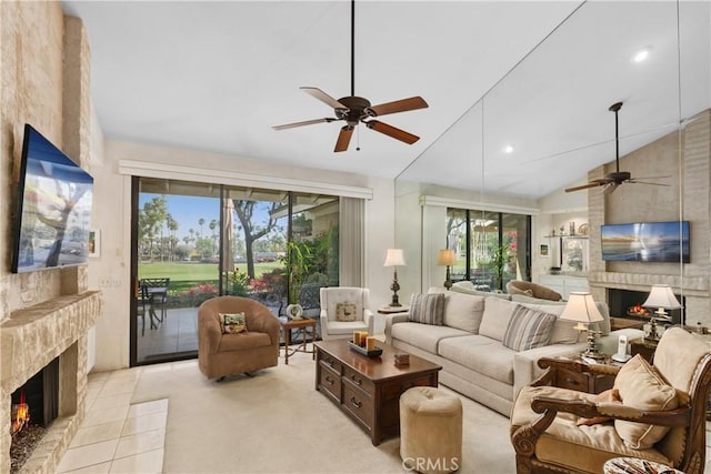 living room featuring ceiling fan, lofted ceiling, and a fireplace