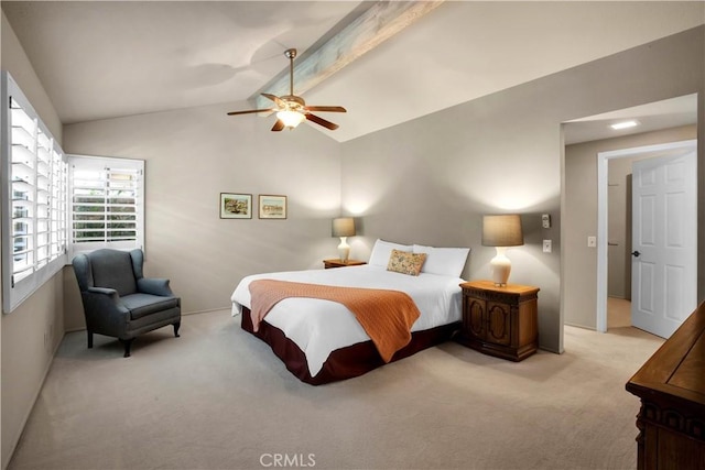 carpeted bedroom featuring ceiling fan and lofted ceiling with beams